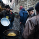 Yashar selling Uzbek "plov" in the market in Lviv.